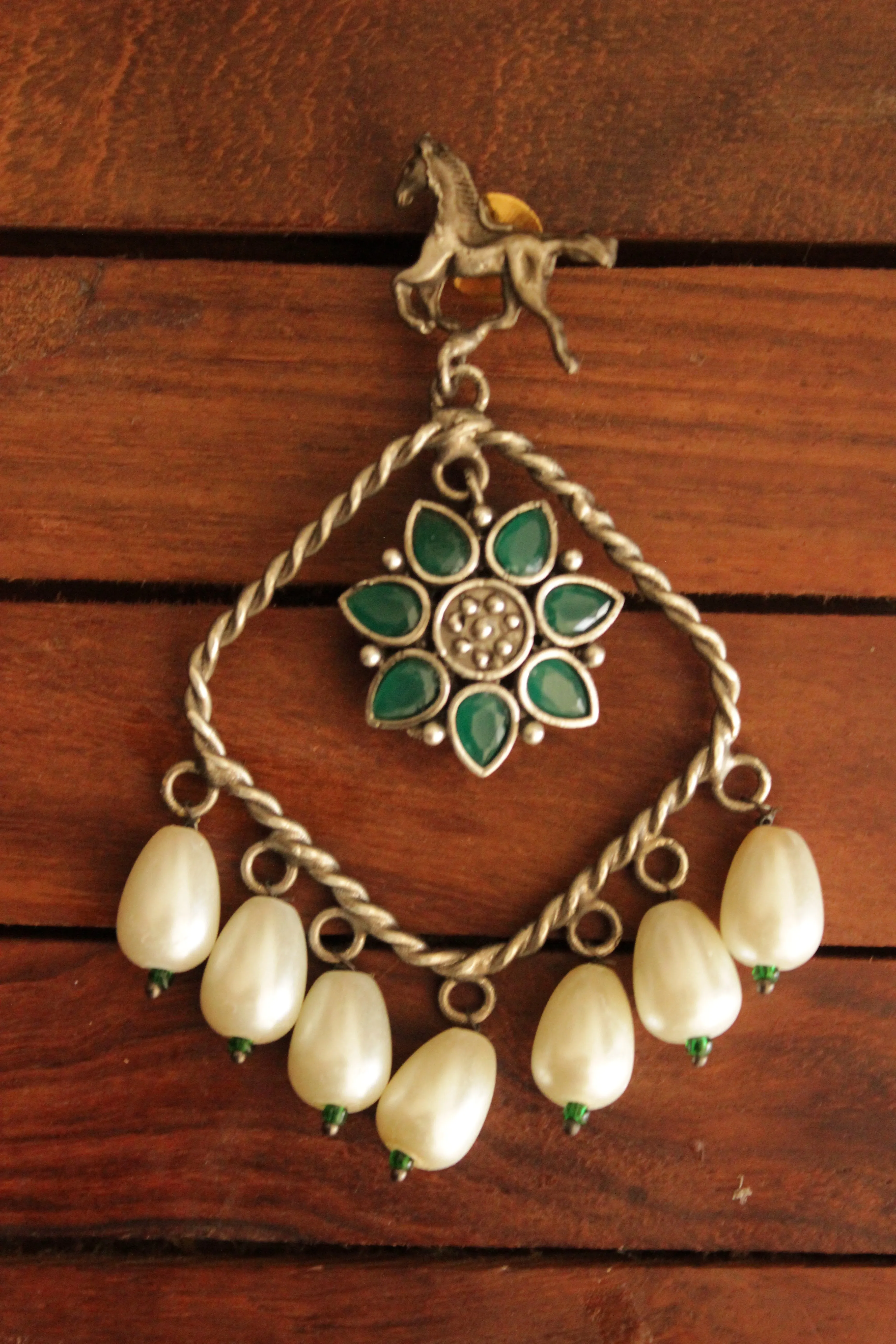 Horse Motif Green Stone Embedded Oxidised Finish Brass Earrings Accentuated with White Pearl Danglers